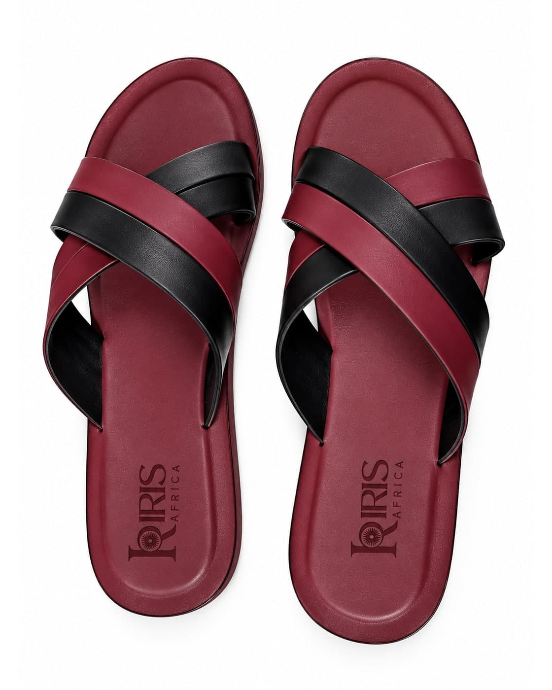 The Double Cross Slide in Burgundy & Black, with crossed leather straps over a burgundy footbed embossed with the IRIS Africa mark